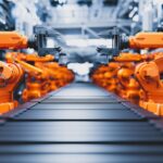 robotic arms along assembly line in modern factory x4a22zu